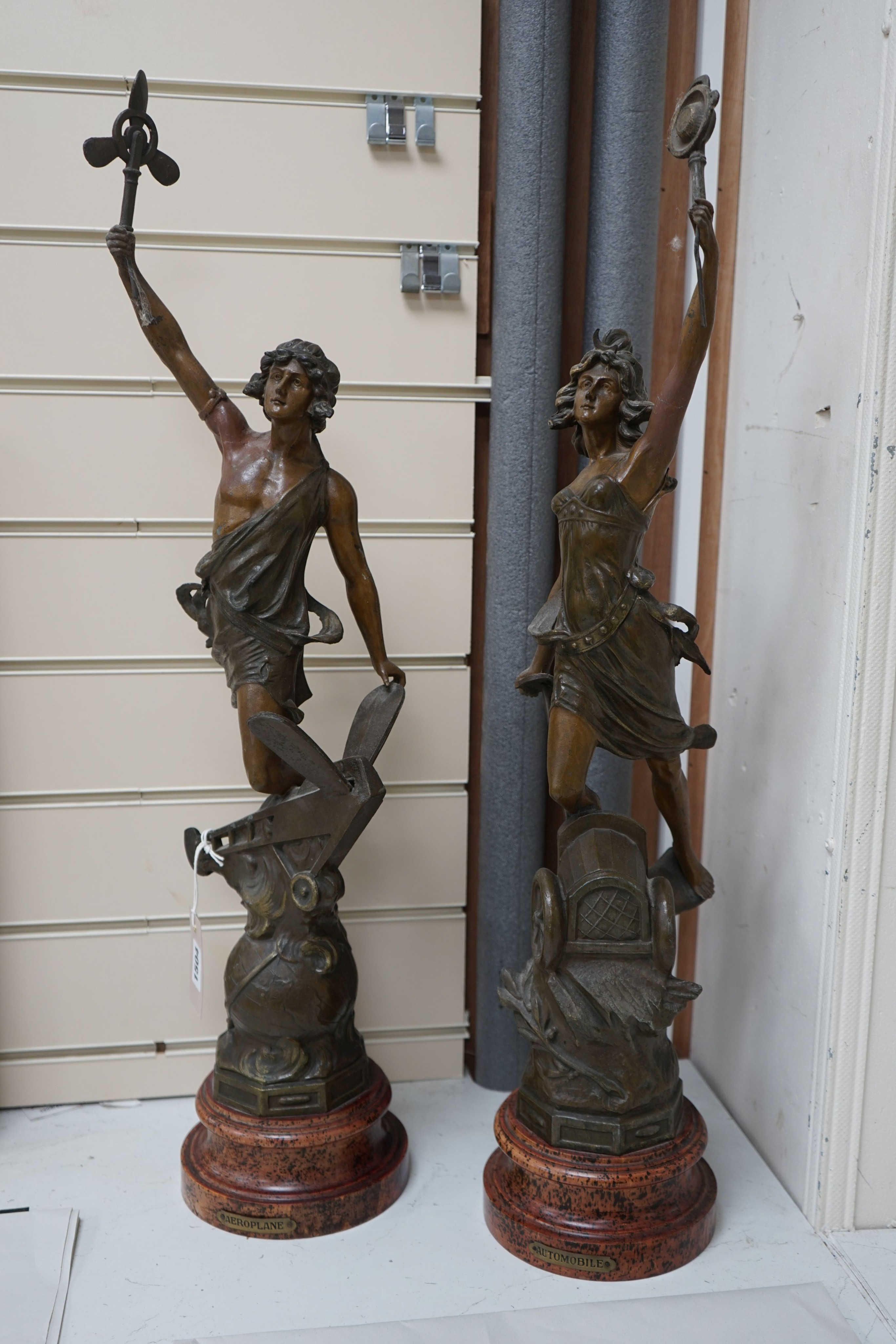 A pair of allegorical spelter figures after Ferrand 'Automobile' and 'Aviation', circa 1907, 72cm